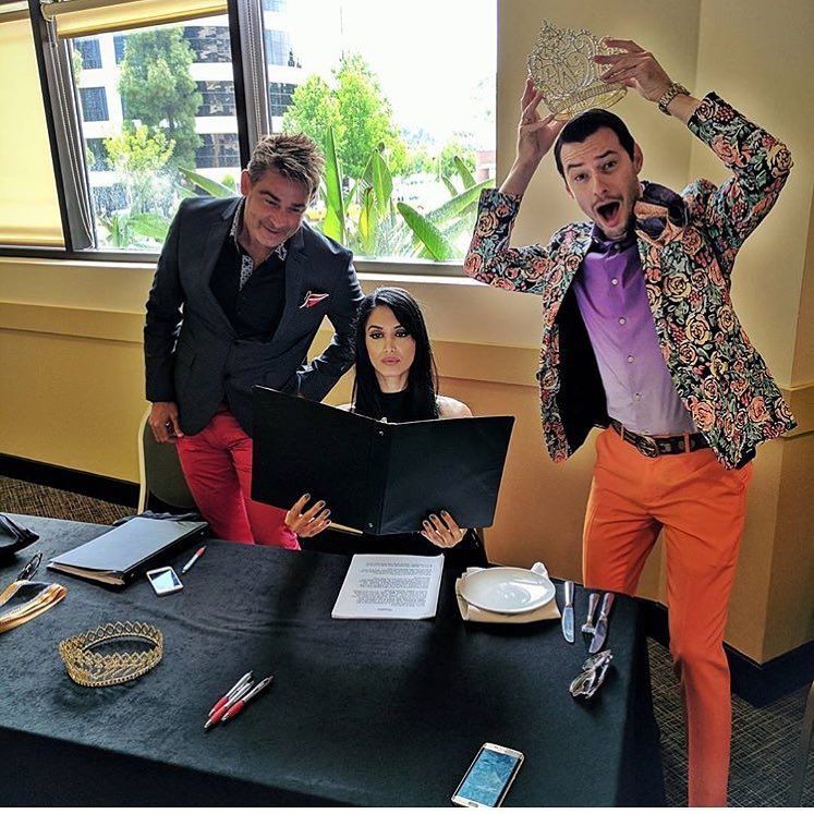 Friends wearing colorful tailoring at a table