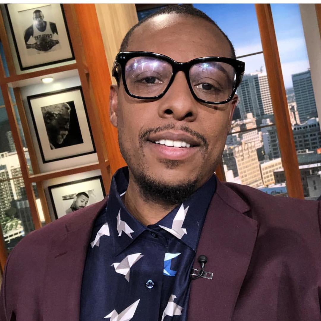 Man wearing a burgundy blazer over a patterned shirt